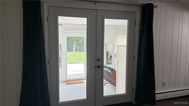 New french doors lead to the 3 season room | Image 36