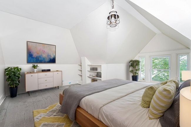 Bedroom with lofted ceiling and light wood-type flooring | Image 22