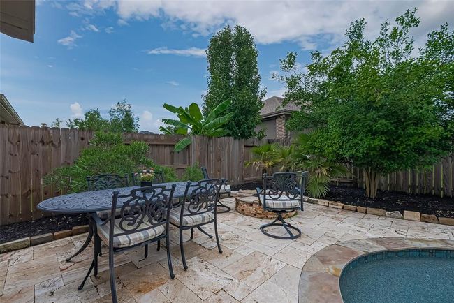 Outside dining area and fire pit | Image 44