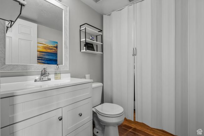 Bathroom featuring vanity and wood finished floors | Image 12