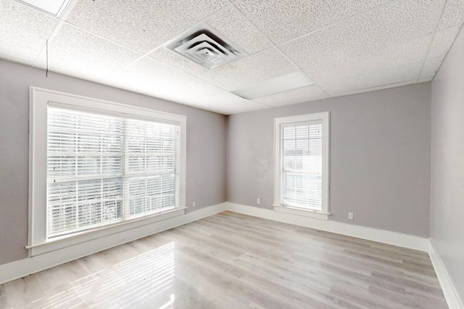 Spare room with a drop ceiling and light hardwood / wood-style flooring | Image 16