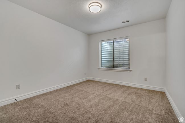 Unfurnished room featuring carpet and baseboards | Image 35