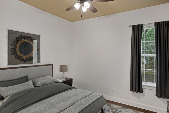 Bedroom featuring dark wood finished floors and a ceiling fan | Image 22