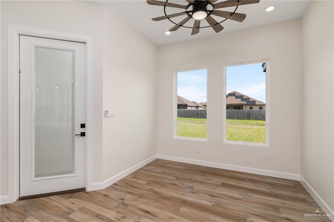 Unfurnished room featuring ceiling fan, light wood-style floors, and recessed lighting | Image 5