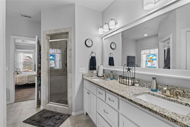 Master bath with separate shower and double sinks. | Image 21
