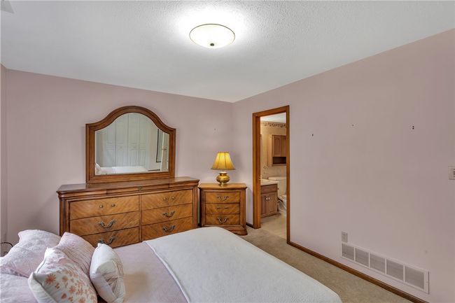 Main Floor Primary Bedroom has a Private en Suite Bath. | Image 20