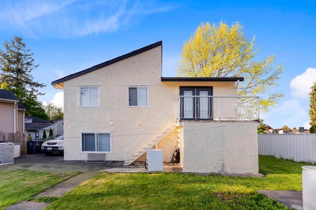 Back of property with stairway and stucco siding | Image 22