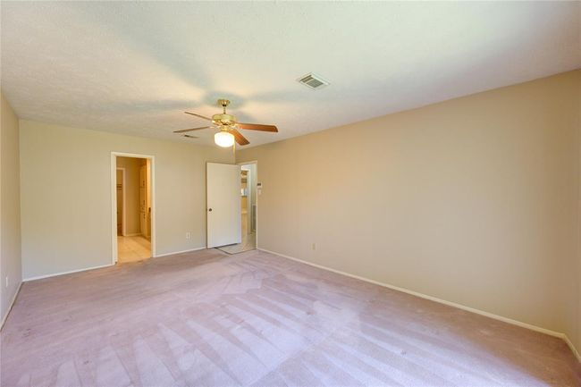 Primary bedroom with en suite bath on left. | Image 16