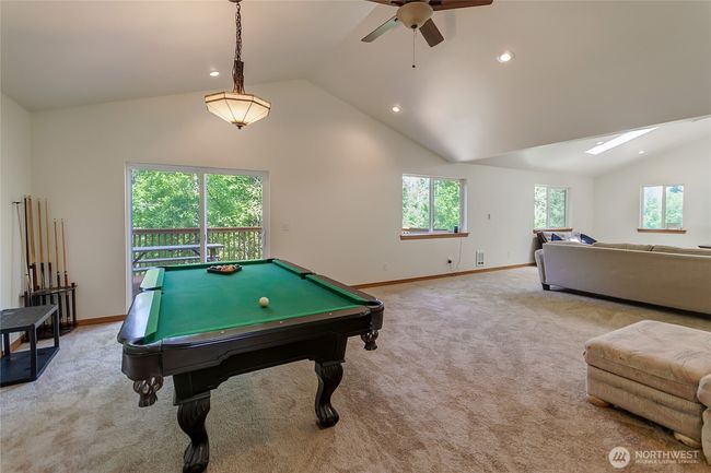 Living space (ADU) above the barn. Slider leads to a deck with territorial views. | Image 25