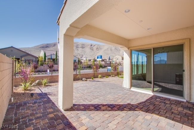 View of patio / terrace with a mountain view and a fenced backyard | Image 12