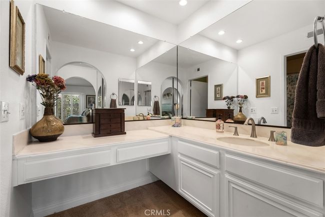 The primary bathroom has a large vanity space | Image 21