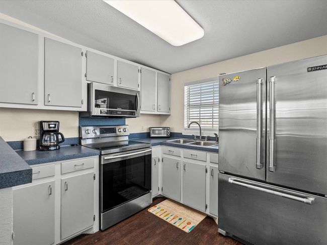 The kitchen is off the dining area | Image 40