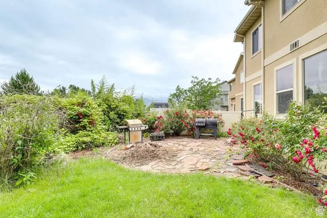 View of yard featuring fence and a patio area | Image 25