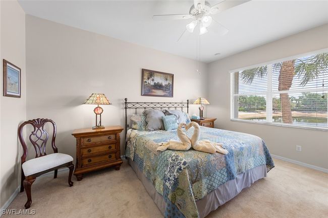 Bedroom featuring baseboards, a ceiling fan, and light colored carpet | Image 5