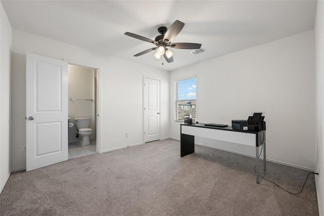 Unfurnished office featuring carpet, a ceiling fan, and baseboards | Image 20