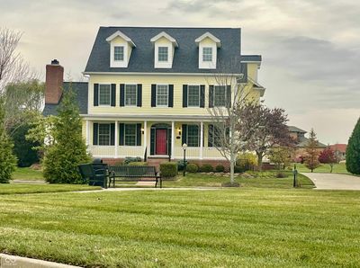 Full front porch is a perfect place to enjoy morning coffee, read a book or visit with friends or neighbors. | Image 1