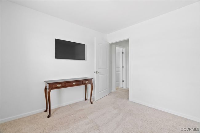 Unfurnished room with baseboards and light colored carpet | Image 23