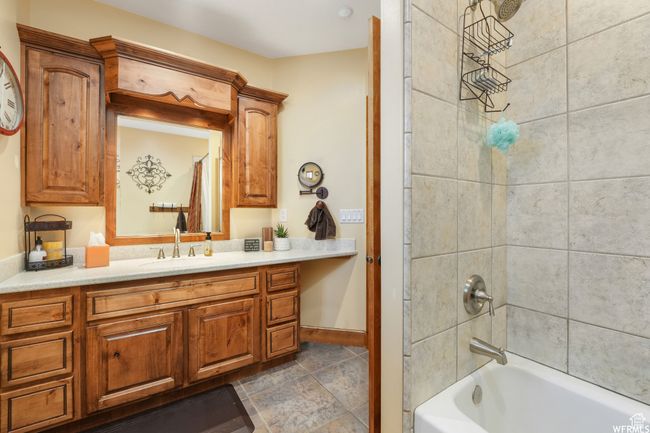 Full bathroom with shower / washtub combination, baseboards, and vanity | Image 28