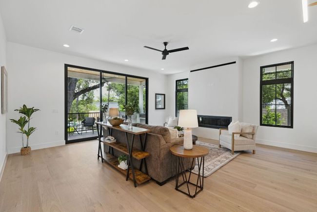 Living area featuring ceiling fan, light wood finished floors, recessed lighting, and baseboards | Image 10