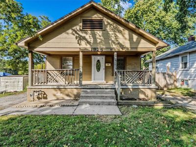 Bungalow-style home featuring a front lawn and covered porch | Image 1