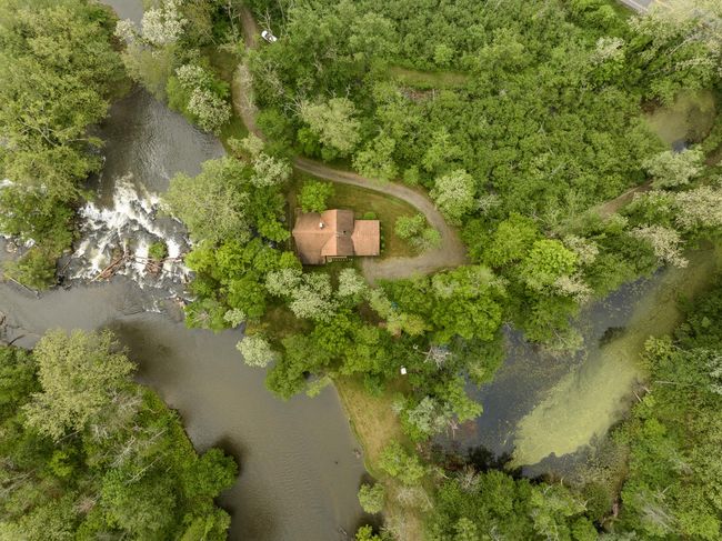 Aerial view of property and surrounding area featuring a large body of water | Image 23