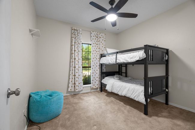 Carpeted bedroom featuring baseboards and ceiling fan | Image 20