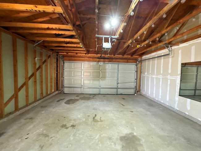 Garage with a garage door opener | Image 36