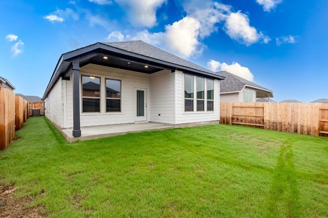 Back of property with a patio area and a shingled roof | Image 32
