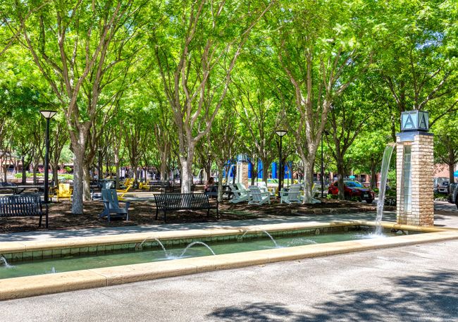 Tree lined parks with water feature. | Image 30