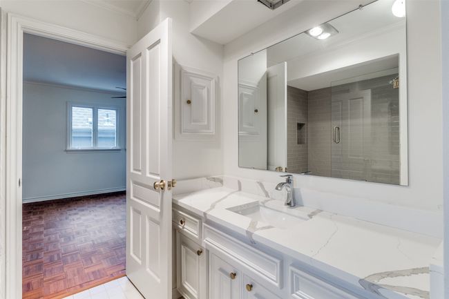 Bathroom with vanity and crown molding | Image 23