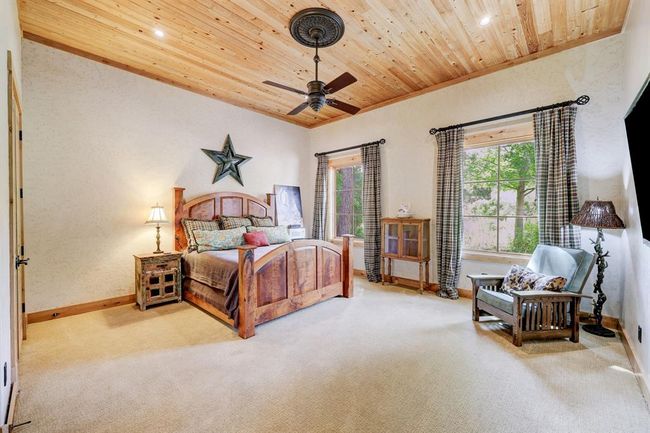 The casita has a walk in closet, built in desk, and room for a seating area. | Image 26
