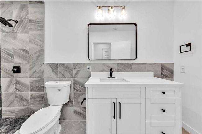 New Vanity, Toilet, Fixtures & Newly Tiled Shower | Image 28