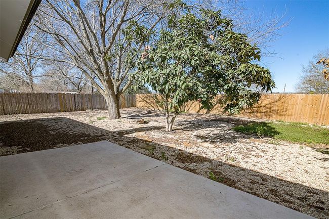 Fenced backyard featuring a patio area | Image 16