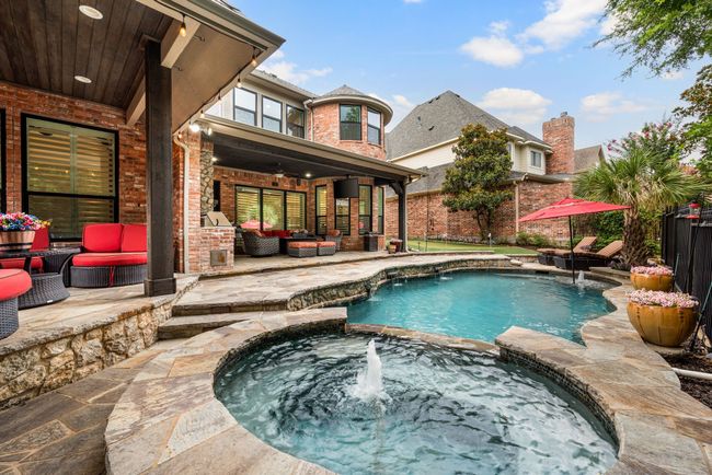 View of swimming pool and spa and 2 outdoor living spaces | Image 36