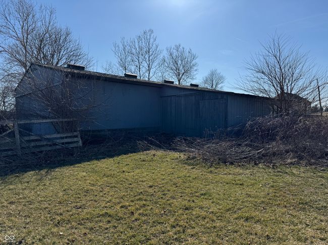 view of yard featuring an outbuilding and an outdoor structure | Image 13