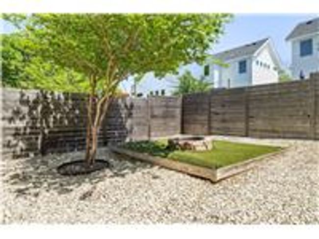 View of yard with an outdoor fire pit and a fenced backyard | Image 29
