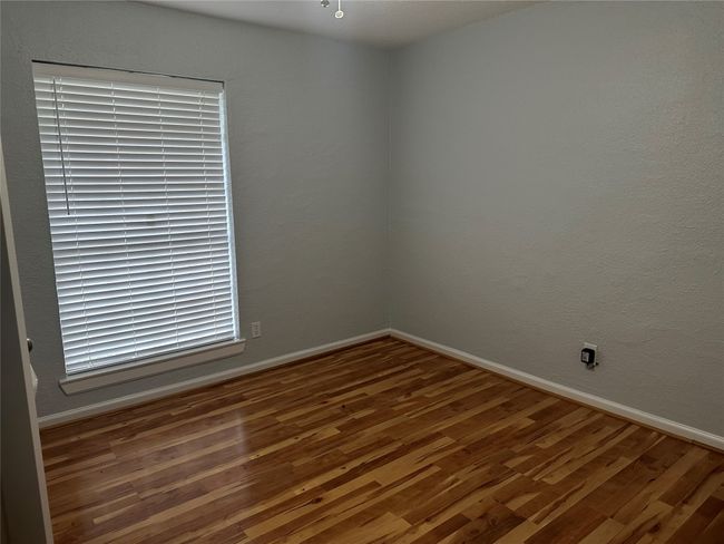 Unfurnished room featuring baseboards and wood finished floors | Image 10
