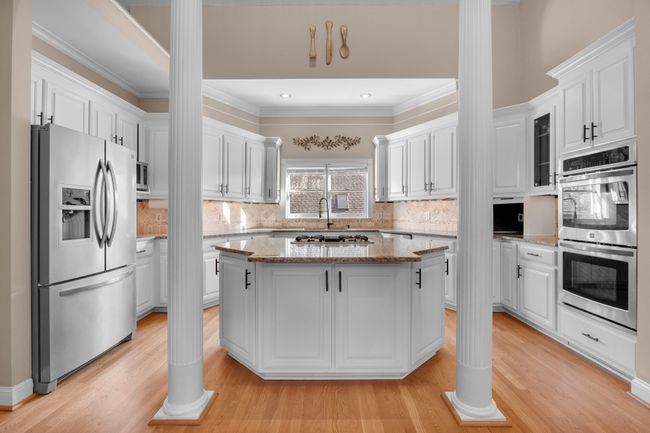 kitchen with huge island for entertaining and gas stove | Image 26