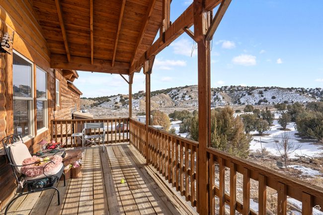 Snow covered deck featuring a mountain view | Image 30