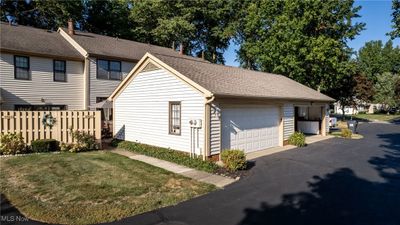 View of home's exterior with a garage and a lawn | Image 3