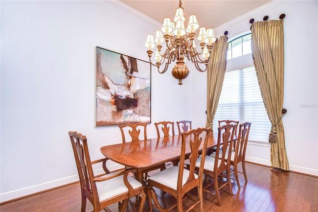 he gleaming hardwood floors guide you to dine in style beneath exquisite lighting. | Image 5