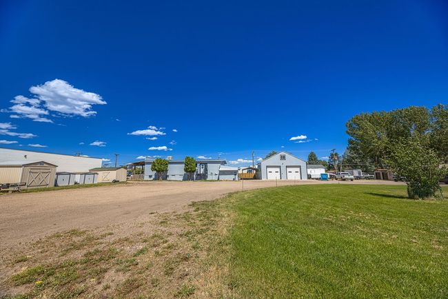 View of yard with a storage unit | Image 26