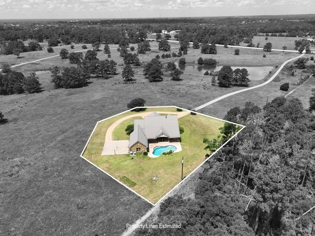 Rear view of Home showcasing estimated property boundaries, offering privacy and an easement to the road. | Image 50