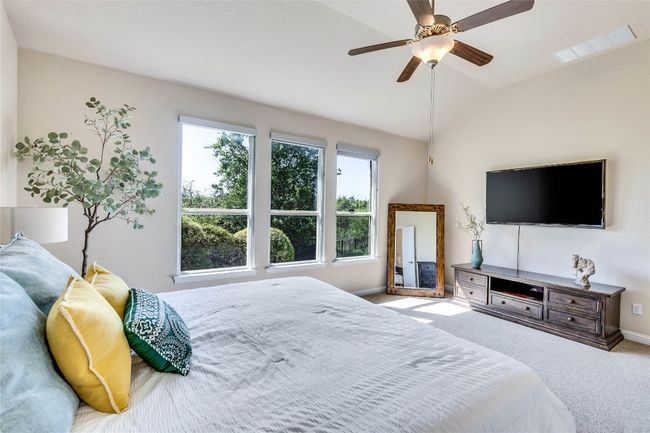 Large primary suite with multiple windows for natural light and greenbelt view | Image 12