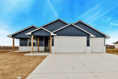 View of front facade featuring a garage | Image 1