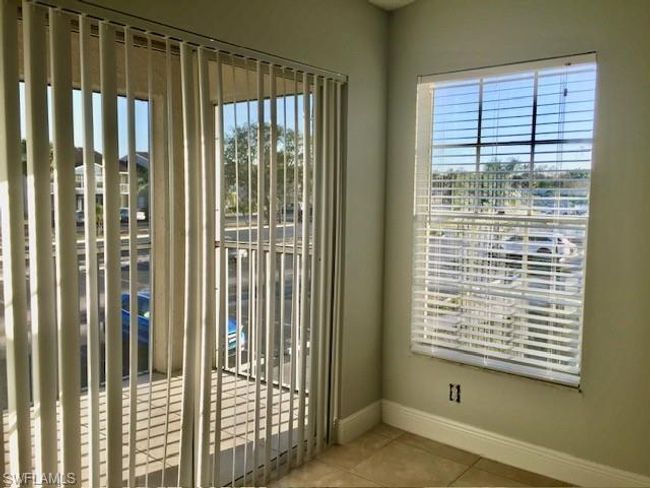 Doorway to outside featuring baseboards, tile patterned flooring, and plenty of natural light | Image 36