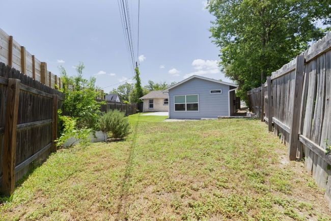 View of fenced backyard | Image 37