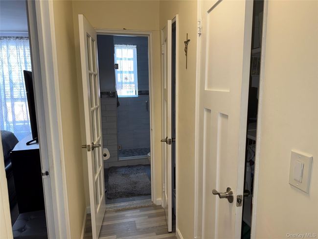 Hallway with wood finished floors and baseboards | Image 10