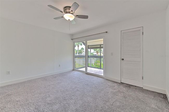 Upstairs primary bedroom with balcony | Image 12