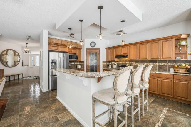 110 Tuscany Ridge Close Nw, Home with 4 bedrooms, 3 bathrooms and 2 parking in Calgary AB | Image 9